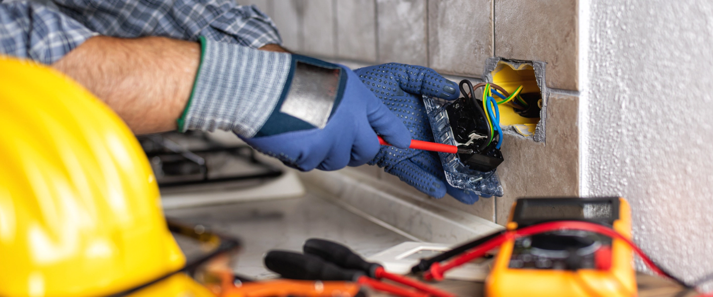 man rewiring an electrical socket canton ga